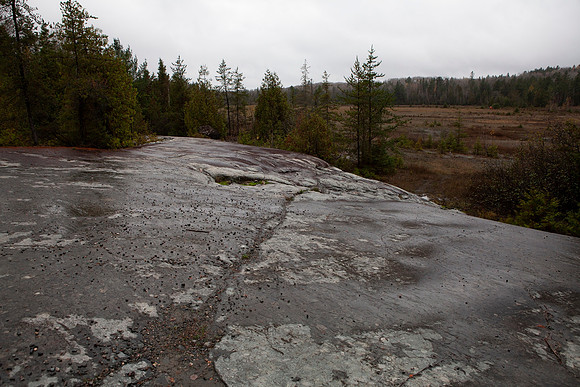 A large smooth rock near one of the mines