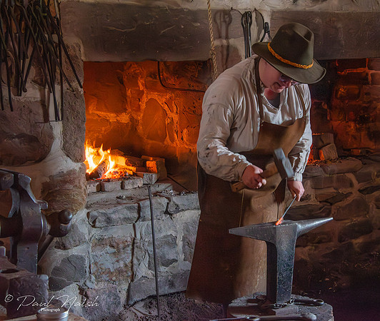 Blacksmith making nails